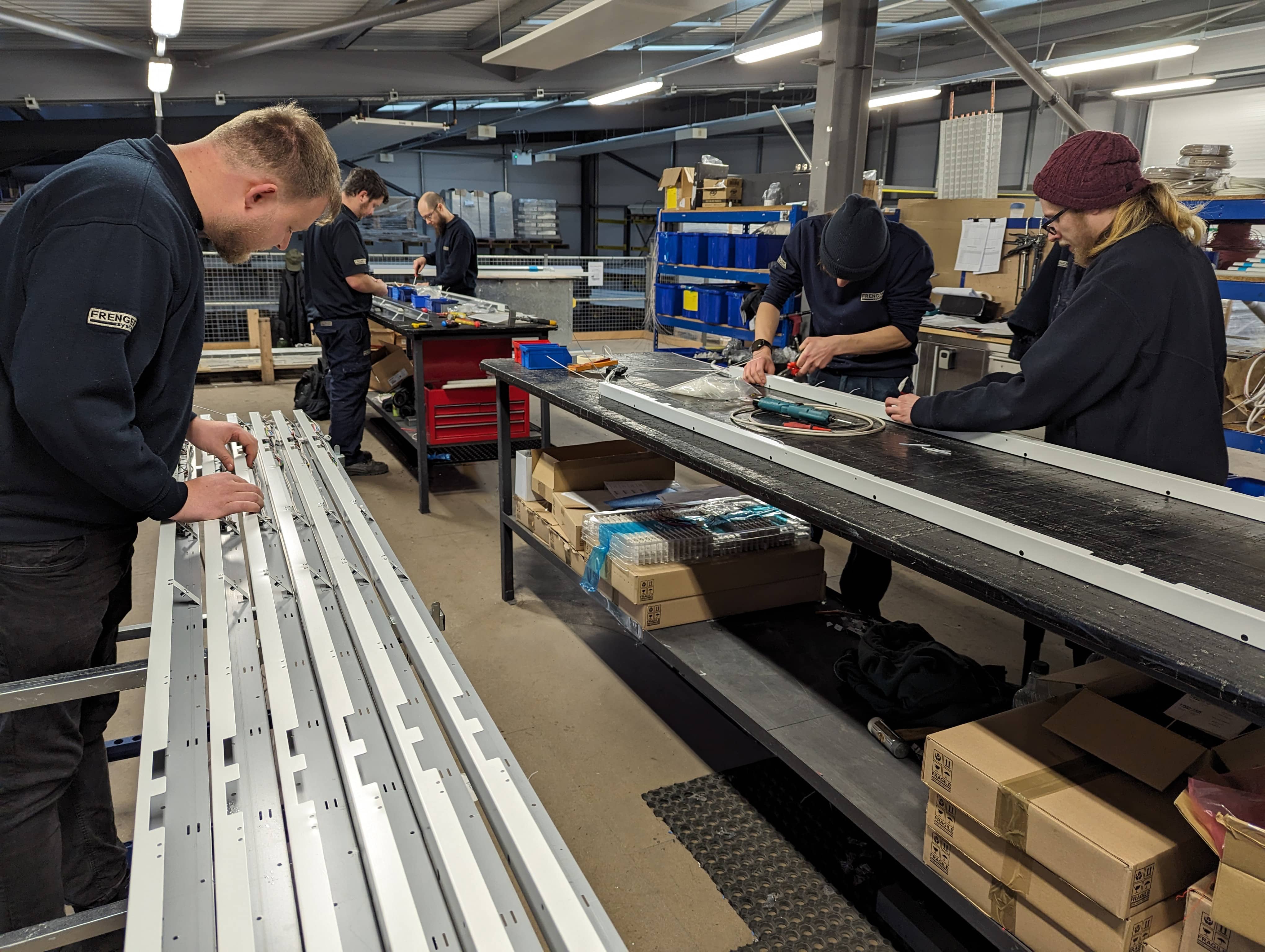 Image of gear trys being assembled Gear Tray Assembly