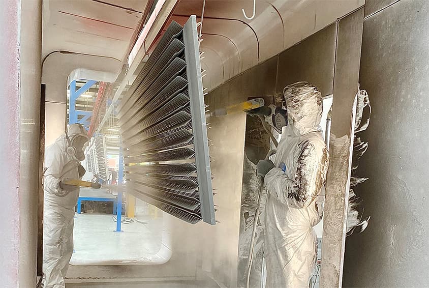 FTF Group's X-Wing Passive Chilled Beam being powder coated in RAL 9006 FTF Group Powder Coating Process