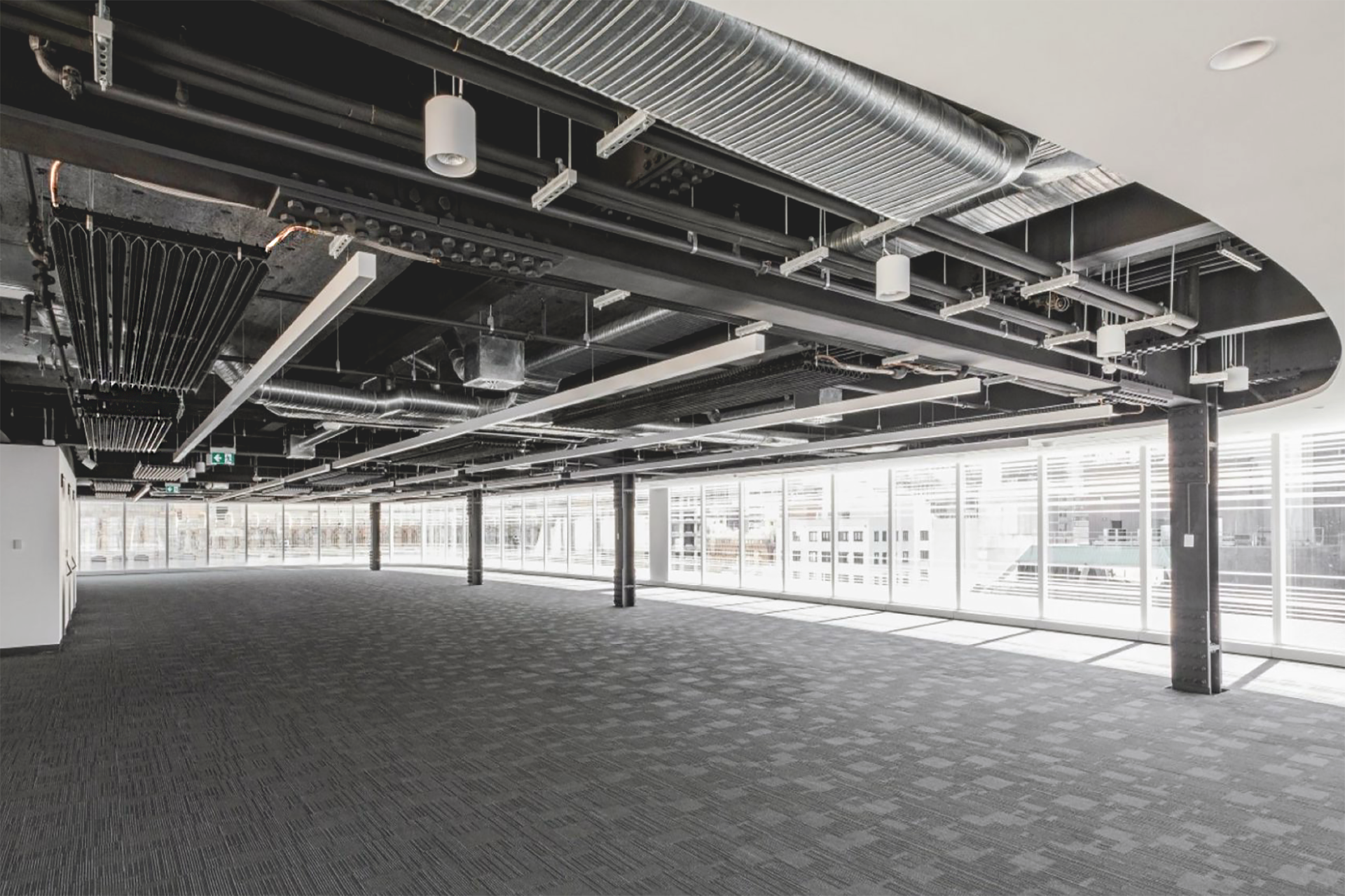 Open plan office inside 183 Clarence Street with FTF Group's X-Wing Radiant Passive Chilled Beams installed Open plan office inside 183 Clarence Street with FTF Group's X-Wing Radiant Passive Chilled Beams installed